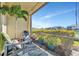 Relaxing patio with comfortable chairs and a view of the lush landscaping at 20228 Lagente Cir, Venice, FL 34293