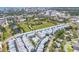 Aerial view of new construction townhome community with park and city skyline at 2340 Lindstrom St, Sarasota, FL 34237