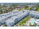 Scenic aerial view of a residential area featuring a community pool and lush landscaping at 2340 Lindstrom St, Sarasota, FL 34237