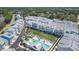 An aerial view of the colorful townhomes with a community pool and putting green at 2340 Lindstrom St, Sarasota, FL 34237
