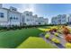 Scenic community backyard offers a synthetic lawn with manicured landscaping, ideal for recreation and relaxation at 2340 Lindstrom St, Sarasota, FL 34237
