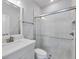 Modern bathroom featuring a glass-enclosed shower, sleek vanity, and neutral tones for a clean and relaxing space at 2340 Lindstrom St, Sarasota, FL 34237