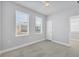 A serene bedroom featuring neutral walls, carpet, and windows that flood the room with natural light at 2340 Lindstrom St, Sarasota, FL 34237