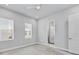 Bedroom with neutral walls, plush carpet, windows, and ensuite bathroom access at 2340 Lindstrom St, Sarasota, FL 34237