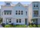 Attractive two-story home with a combination of white and blue exterior and well-kept landscaping at 2340 Lindstrom St, Sarasota, FL 34237