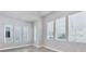 Bright living room with large windows providing ample natural light and neighborhood views at 2340 Lindstrom St, Sarasota, FL 34237
