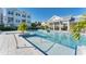 Gorgeous community pool including zero entry, sun loungers, and elegant architecture at 2340 Lindstrom St, Sarasota, FL 34237