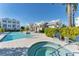 Relaxing community pool area offering a hot tub, sun loungers, and convenient seating at 2340 Lindstrom St, Sarasota, FL 34237