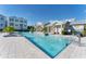 Beautiful community pool showcasing zero entry, sun loungers, and stunning buildings on a clear day at 2340 Lindstrom St, Sarasota, FL 34237