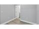 A simple room showcasing durable laminate flooring, clean white trim, and fresh neutral paint at 2340 Lindstrom St, Sarasota, FL 34237