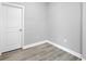 A simple room showcasing durable laminate flooring, clean white trim, and fresh neutral paint at 2340 Lindstrom St, Sarasota, FL 34237