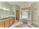 Spacious primary bathroom with a soaking tub, separate shower, and double vanity at 2611 221St E St, Bradenton, FL 34211