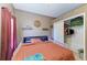 This cozy bedroom has a ceiling fan and closet at 2611 221St E St, Bradenton, FL 34211