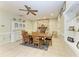 Dining room with beautiful stone fireplace, neutral paint, and tile floors at 2611 221St E St, Bradenton, FL 34211