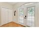 Bright entryway features double doors with blinds, a closet, and wood-look floors at 2611 221St E St, Bradenton, FL 34211