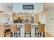 Kitchen with granite counters, stainless steel appliances, tile backsplash, and counter seating at 2611 221St E St, Bradenton, FL 34211