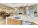Spacious kitchen featuring granite countertops, modern appliances, and bar seating for entertaining at 2611 221St E St, Bradenton, FL 34211