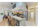 Spacious kitchen with granite counters, stainless steel appliances, counter seating, and open to the living room at 2611 221St E St, Bradenton, FL 34211