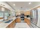 The kitchen is equipped with stainless steel appliances, granite counters, and ample cabinet space at 2611 221St E St, Bradenton, FL 34211