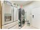 Well-organized laundry room with stainless steel appliances, storage, and a convenient layout at 2611 221St E St, Bradenton, FL 34211