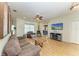 Inviting living room with wood-look flooring, neutral paint, and a ceiling fan at 2611 221St E St, Bradenton, FL 34211