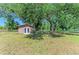Well-maintained shed provides extra storage space on a grassy lot at 2611 221St E St, Bradenton, FL 34211
