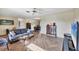 Open living area with a dining space and comfortable furnishings, showcasing the herringbone flooring at 2707 Vinson Ave, Sarasota, FL 34232