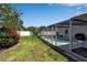 Lush backyard featuring a screened-in pool area, perfect for relaxation and outdoor entertaining at 3130 Key Way, Sarasota, FL 34239