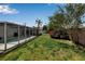 Lush backyard featuring a screened-in pool area, perfect for relaxation and outdoor entertaining at 3130 Key Way, Sarasota, FL 34239