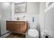 Bathroom features a modern vanity with a mirror and tiled walls and flooring at 3130 Key Way, Sarasota, FL 34239