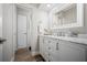 Bathroom featuring a vanity with marble countertop, drawers, and modern fixtures at 3130 Key Way, Sarasota, FL 34239