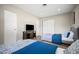 Bedroom features two beds, a tv and two closets, all in a bright well-lit room at 3130 Key Way, Sarasota, FL 34239