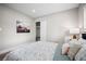 Bedroom features a floral comforter, bedside table and lamp in a naturally lit room at 3130 Key Way, Sarasota, FL 34239