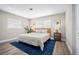 Well-lit bedroom with a bed and minimalistic decor at 3130 Key Way, Sarasota, FL 34239