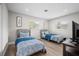 Bedroom with two beds, wood-look flooring, overhead lighting and two windows at 3130 Key Way, Sarasota, FL 34239