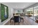 Dining room with a view of the patio, decorative wall art and neutral decor at 3130 Key Way, Sarasota, FL 34239