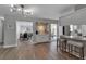 Open living area with bar seating, modern lighting, and access to the outside patio at 3130 Key Way, Sarasota, FL 34239