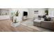 Cozy living room featuring an L-shaped couch, modern rug, and a unique indoor plant feature at 3130 Key Way, Sarasota, FL 34239