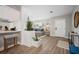 Inviting open-concept living area with barstool seating, brick planter, and bright front entry at 3130 Key Way, Sarasota, FL 34239
