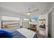 Primary bedroom featuring wood floors, two windows and a ceiling fan at 3333 26Th E Ave # 1004, Bradenton, FL 34208