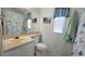 Bathroom featuring a cream-colored sink and a nautical-themed shower curtain at 3333 26Th E Ave # 1257, Bradenton, FL 34208