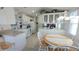 Spacious kitchen with dining area, white appliances, and plenty of cabinet space, ideal for cooking and gathering at 3333 26Th E Ave # 1257, Bradenton, FL 34208