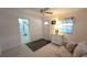 Bright living room features neutral walls, carpet, and a comfortable sofa with beachy accents at 3333 26Th E Ave # 1257, Bradenton, FL 34208