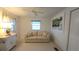 Bright living room features neutral walls, carpet, and a comfortable sofa with beachy accents at 3333 26Th E Ave # 1257, Bradenton, FL 34208