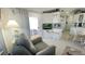 Bright living room with a view of the patio and adjacent kitchen, creating a seamless indoor-outdoor flow at 3333 26Th E Ave # 1257, Bradenton, FL 34208