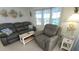 Cozy living room features comfortable seating, a bright window, and coastal decor at 3333 26Th E Ave # 1257, Bradenton, FL 34208