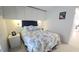Cozy main bedroom with built-in storage, decorative lighting, and a large window at 3333 26Th E Ave # 1257, Bradenton, FL 34208