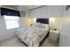 Cozy main bedroom with built-in storage, decorative lighting, and a large window at 3333 26Th E Ave # 1257, Bradenton, FL 34208