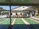 Community shuffleboard courts next to clubhouse, offering recreational activities for residents at 3333 26Th E Ave # 1257, Bradenton, FL 34208