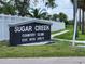 Sugar Creek Country Club sign on a well-maintained lawn at 3333 26Th E Ave # 1257, Bradenton, FL 34208